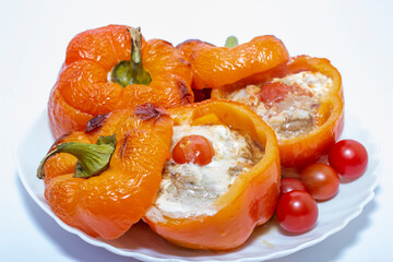 Stuffed with minced meat peppers. Close up on white background