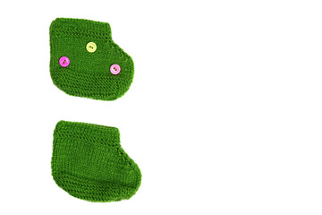 pair of handmade children's knitted socks isolated on white