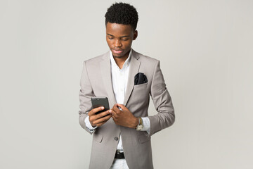 handsome young african male with mobile phone