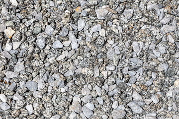 Natural background with small gray stones. Can be used in design as an abstract background, texture.