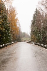 Countryroad over bridge in snowy conditions.