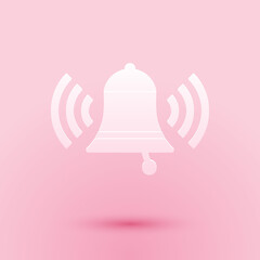 Paper cut Ringing bell icon isolated on pink background. Alarm symbol, service bell, handbell sign, notification symbol. Paper art style. Vector.