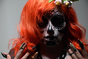 Zombie girl. Stodio portrait of female model with Halloween makeup. Halloween conception