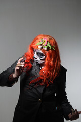 Zombie girl. Stodio portrait of female model with Halloween makeup. Halloween conception