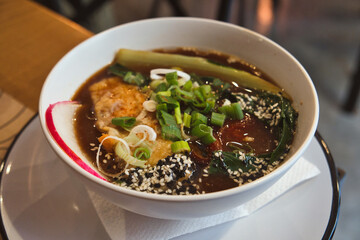 Delicious Japanese vegan dish - ramen soup with noodles, vegetables and shiitake mushrooms
