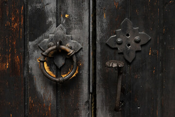 Black vintage door handle on old door