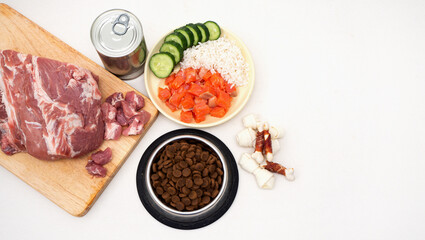 dog food includes dry pellets, treats and canned foods along with a natural diet of fresh meat, fish, rice and vegetables. choice between dry food and natural food