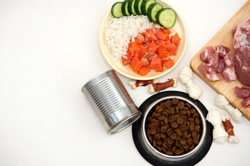 dog food includes dry pellets, treats and canned foods along with a natural diet of fresh meat, fish, rice and vegetables. choice between dry food and natural food