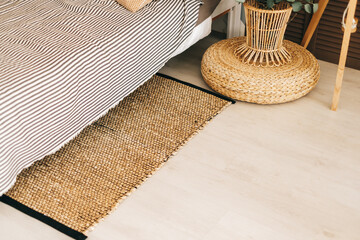 Eco-friendly bedside mat in modern bedroom interior.