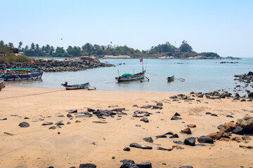 Fototapeta premium Old wooden fishing boats on the sandy shore of the Indian ocean