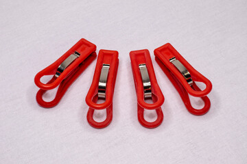 Red plastic clothespins.
