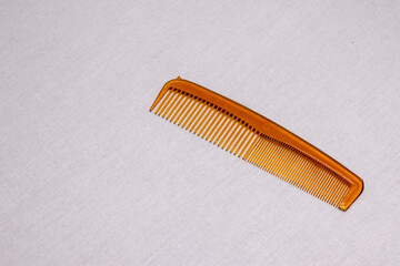 Plastic comb on a white background.