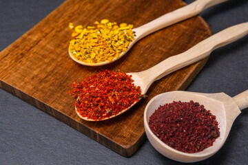 spices on dark vintage background. Healthy eating and cooking concept. Dark rustic style.