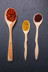 spices and herbs on a dark background. Food and kitchen ingredients. vertical photo