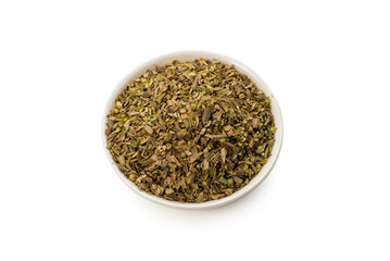 Oregano in a bowl isolated.