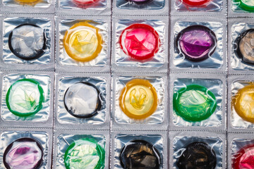 Colorful condoms background.