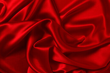 Obraz premium Red silk or satin luxury fabric texture can use as abstract background. Top view.