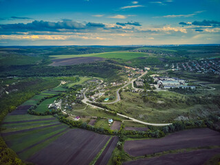 Little moldavian village Goeni in green lands, aerial view, summer time, Moldova republic of.