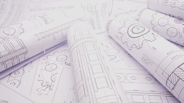 paper engineering drawings of industrial parts and mechanisms