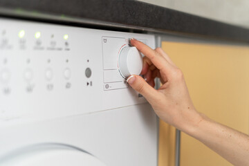 Modern washing machine equipment stands at home