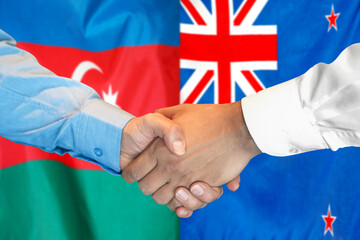 Business handshake on the background of two flags. Men handshake on the background of the Azerbaijan and New Zealand flag. Support concept