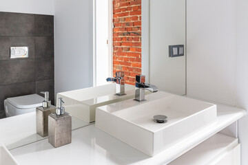 Modern white bathroom vessel and silver soap container