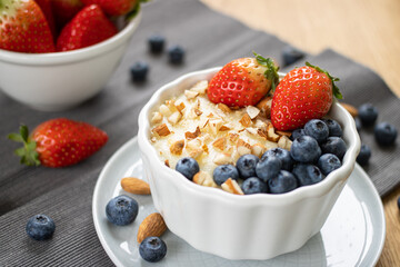 Close up of semolina with strawberries and blueberries