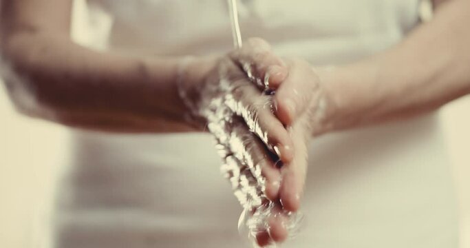 Washing hands with water and soap