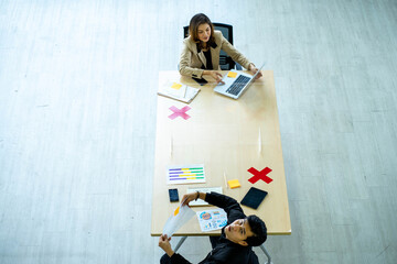 business man working apart from colleague  in the office. new normal social distancing concept.