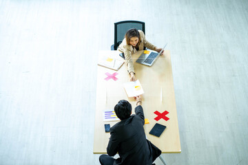 business man working apart from colleague  in the office. new normal social distancing concept.