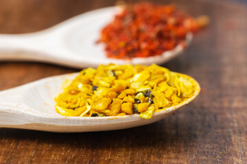 Spices and herbs in wooden bowls. Food and kitchen ingredients. selective focus