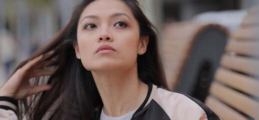 Young Asian woman in a city - people photography