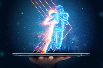 A silhouette of an American football player crawls out of a smartphone. Online sports concept,...