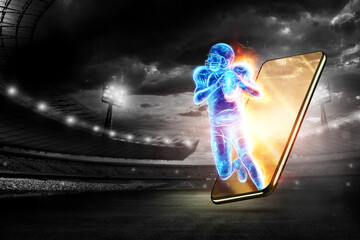 A silhouette of an American football player crawls out of a smartphone. Online sports concept,...