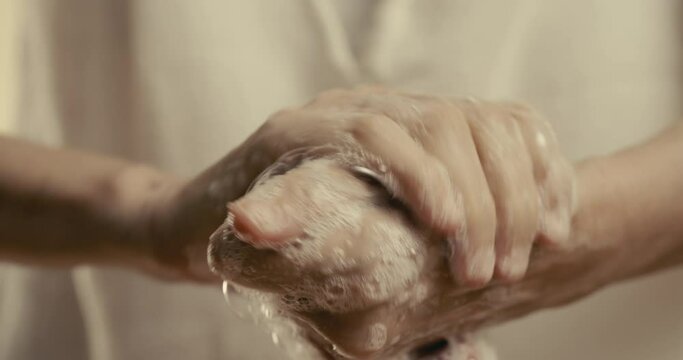 Washing hands with water and soap