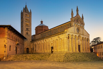 Fototapeta na wymiar View of the Cathedral of Saint Cerbonius with Bell tower at the Garibaldi place in Massa Marittima, taken at night Maremma, Tuscany - Italy