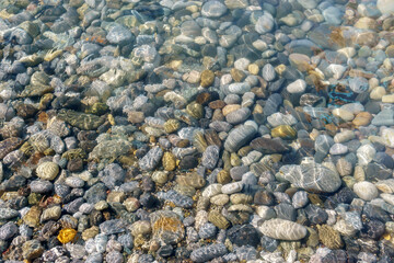 clear sea water on a rocky beach. selective focus