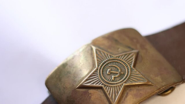 Old soldier's belt buckle with the symbols of the Soviet Union.