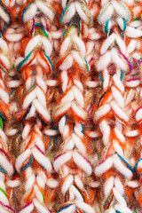 close up texture of knitted colourful scarf