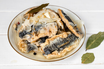 Fried herring in a vinegar marinade with a bay leaf, mustard and allspice