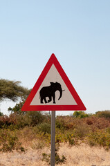 Warning elephants crossing sign along a road in Botswana, Africa