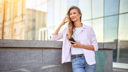 Businesswoman standing summer day near corporate building  Business person