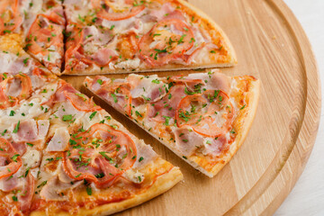 Pizza top view cutted on 8 pieces and one pushed forward. Advert for pizzeria caffee and restaurant. Food delivery at quarantine covid-19 concept.