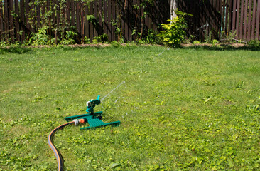 automatic watering of the lawn at their summer cottage in the village