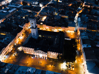 night aerial view of old european city with tight streets