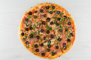 Big pizza isolated on white background. Tasty fast food at quarantine coronavirus covid-19 period. Food delivery for people who stay at home