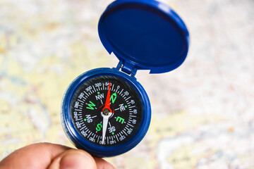 Compass on the background of the map.