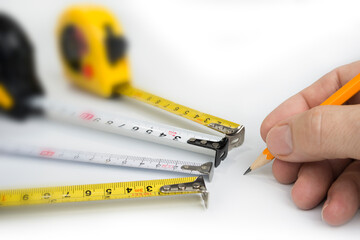 Measure tapes  on a white background. Inches and centimeters