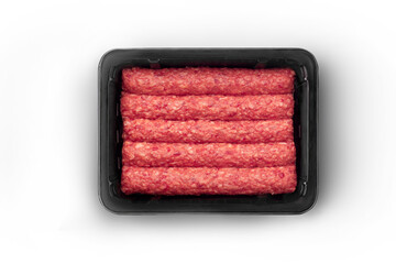 Opened black plastic tray with fresh raw beef kebabs top-view. Packaging template mockup...