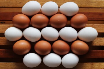 Rows of brown and white eggs